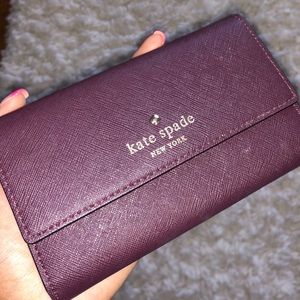 A cute purple Kate Spade wristlet!!